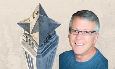 The top of the monument beside the head of Gregg Dimmick..