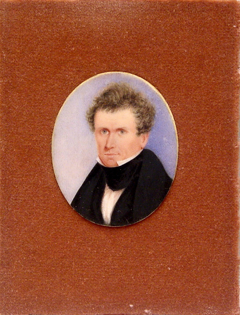 Miniature portrait of a am with curling brown hair and high collar points.